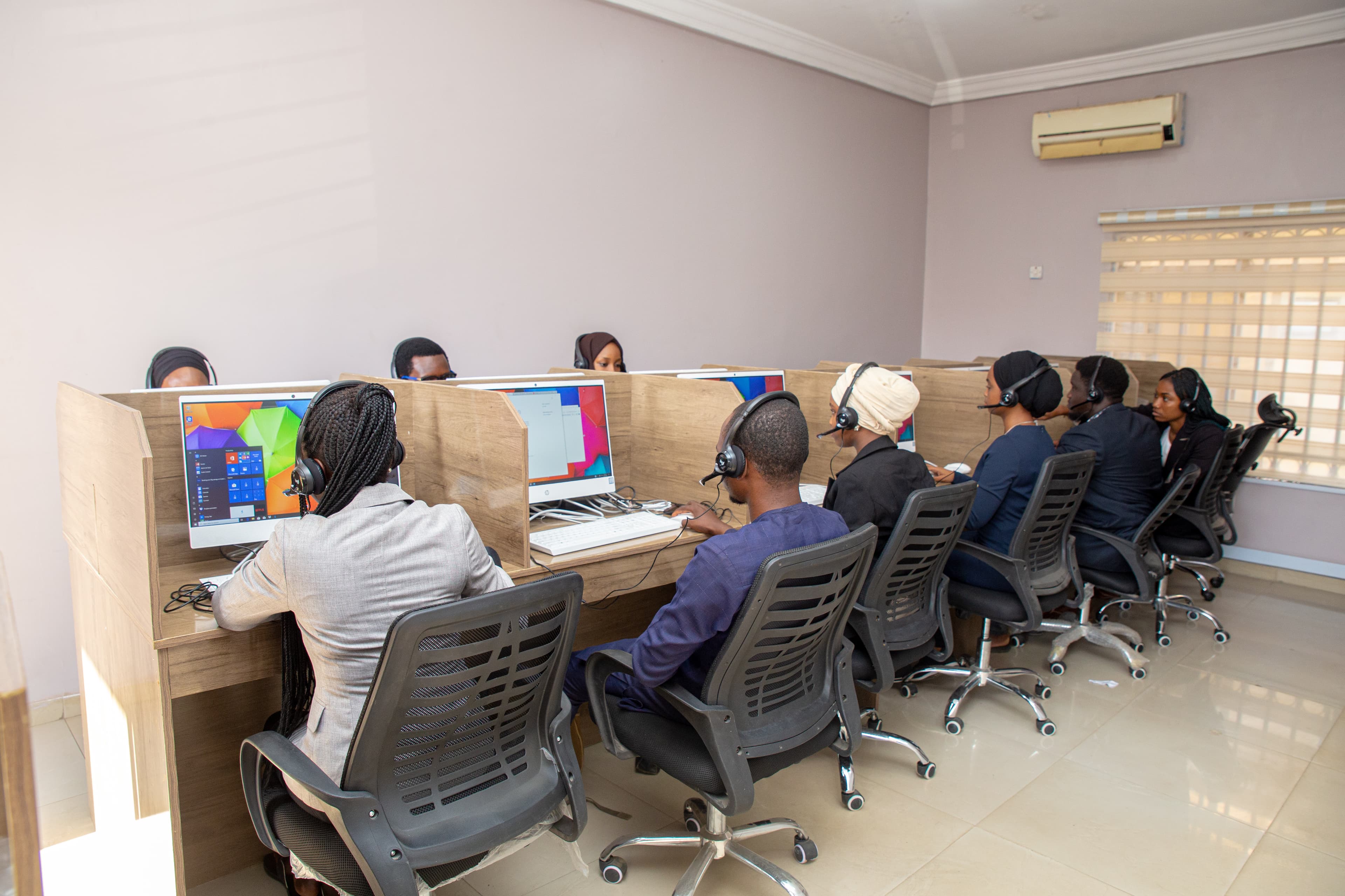 Rows of TeleConnect agents working at their desks