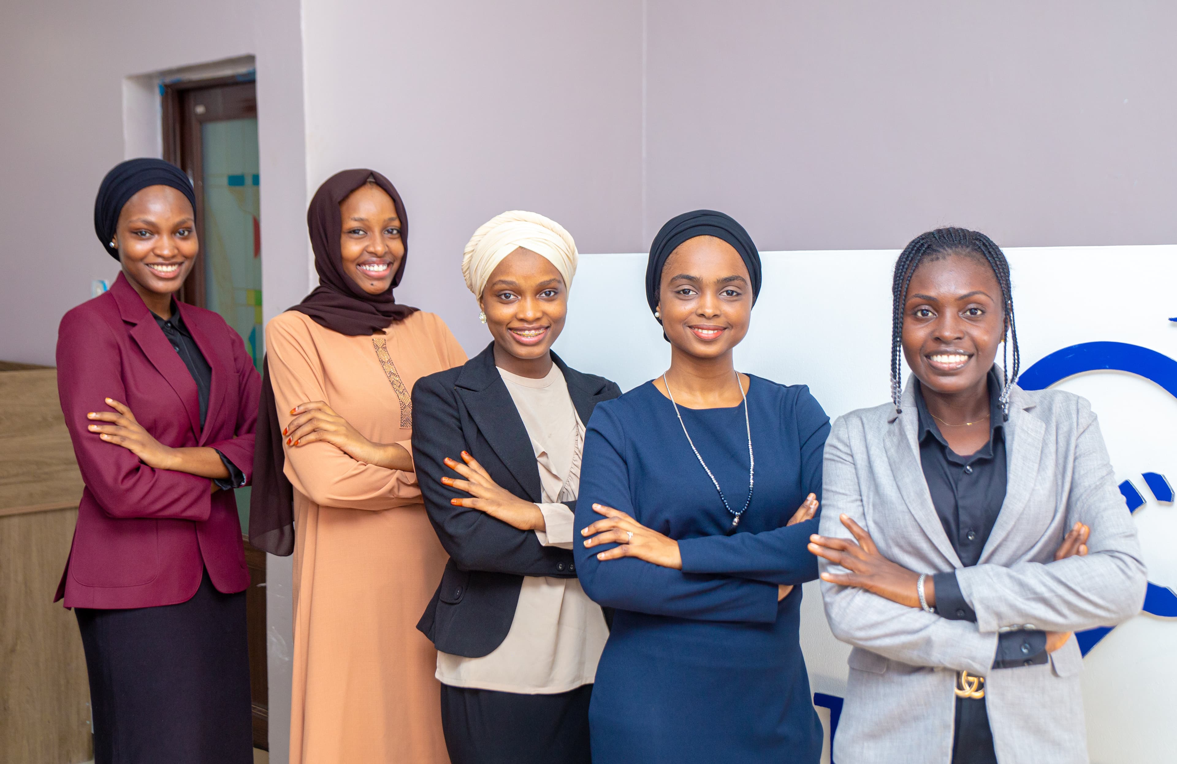 Five TeleConnect staff members standing together
